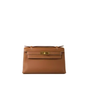 Hermès Kelly Pochette de cuero Swift color Gold con herrajes dorados – bolso de mano compacto y elegante de lujo
