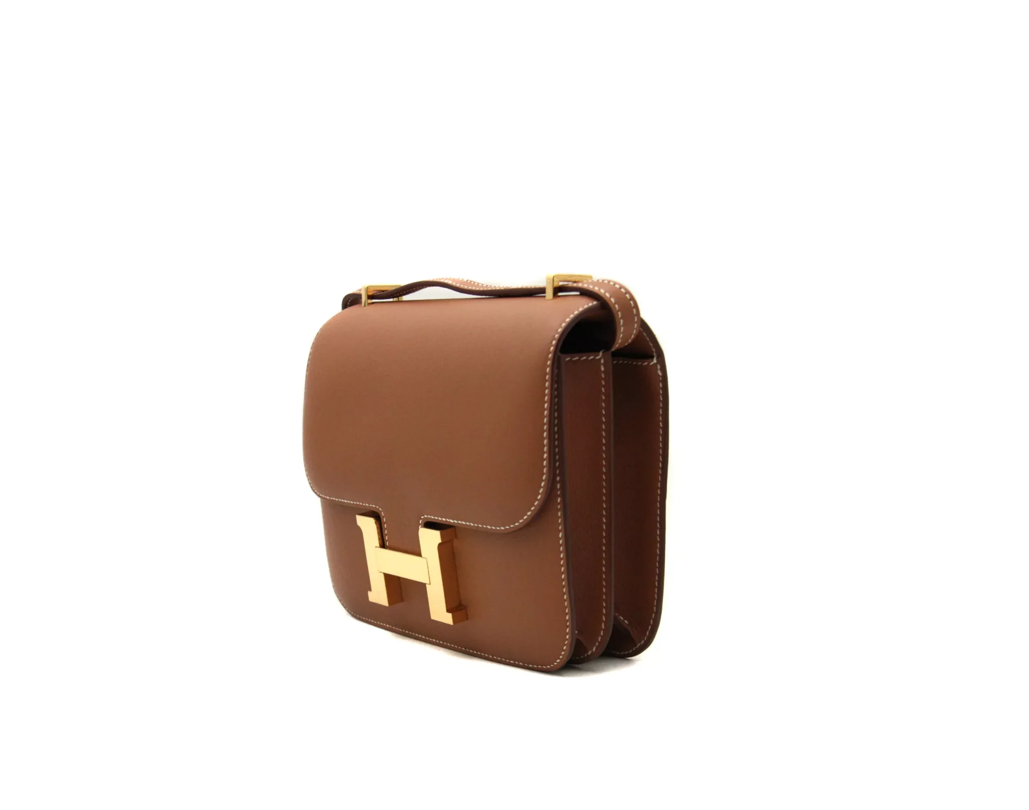 Hermès Constance 18 Gold Swift leather with gold hardware – mini luxury crossbody handbag in camel brown - profile